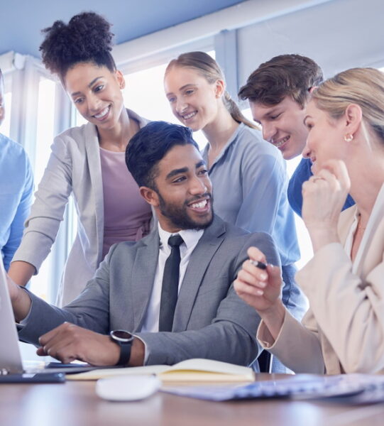 Business people, laptop and team collaboration in meeting, planning or idea strategy at office desk.